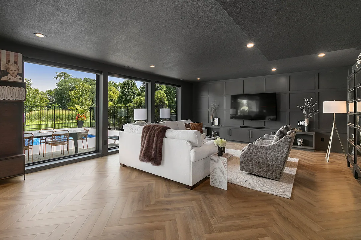 white sofa with herringbone hardwood floors