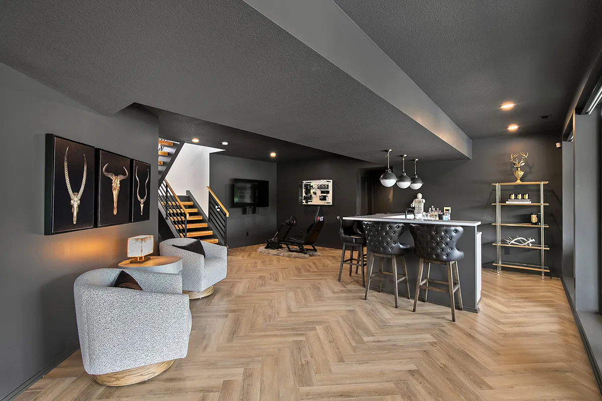 Modern mixed use loft with herringbone hardwood and dark walls 