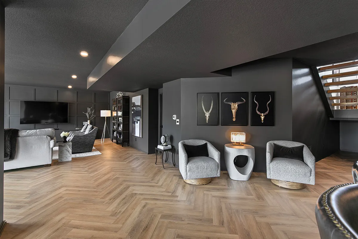 Black and grey room with hardwood 