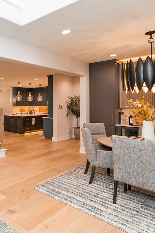 Modern dining room with kitchen view and cool lighting 