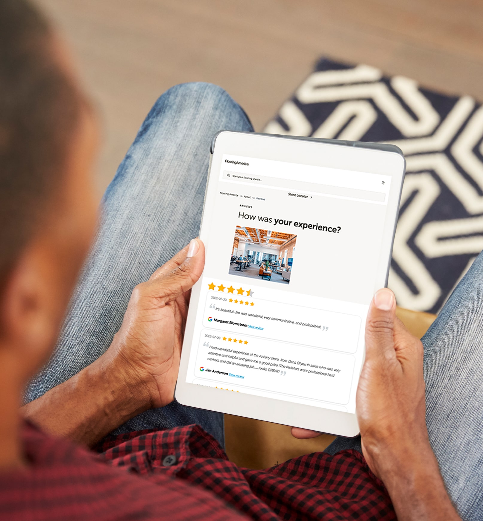 person holding tablet and reading reviews